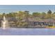 Community clubhouse with a fountain and lake view offering resort-style living at 413 Summit Ridge Pl # 115, Longwood, FL 32779