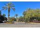 Community entrance with palm trees, well-manicured landscaping and Sabal Point sign at 413 Summit Ridge Pl # 115, Longwood, FL 32779
