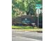 Elegant brick community sign with mature landscaping, creating an inviting entrance for the residences at 413 Summit Ridge Pl # 115, Longwood, FL 32779