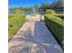 Paved walkway and stairs leading to a community picnic area by the water at 413 Summit Ridge Pl # 115, Longwood, FL 32779