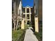 Inviting condo exterior with pathway and landscaping, offering a charming welcome at 413 Summit Ridge Pl # 115, Longwood, FL 32779