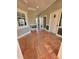 Hallway with tile floor, fitness center, and access to restrooms in a community clubhouse at 413 Summit Ridge Pl # 115, Longwood, FL 32779