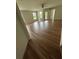 Bright living room with natural light, backyard access, and wood floors at 413 Summit Ridge Pl # 115, Longwood, FL 32779