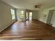 Bright and expansive living area featuring new floors, fresh paint, and open layout for easy living at 413 Summit Ridge Pl # 115, Longwood, FL 32779