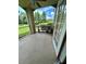 Screened-in patio featuring a ceiling fan and views of the landscaped yard and pond at 413 Summit Ridge Pl # 115, Longwood, FL 32779