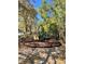 Neighborhood playground surrounded by leafy trees, featuring slides and a mulched play area at 413 Summit Ridge Pl # 115, Longwood, FL 32779
