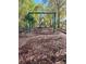 A well-equipped community playground with swings and slides, set in a mulched area at 413 Summit Ridge Pl # 115, Longwood, FL 32779