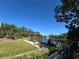 Community pool area with a lake fountain, pergola seating, landscaping, and BBQ at 413 Summit Ridge Pl # 115, Longwood, FL 32779