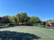 Community tennis court with landscaping and parking at 413 Summit Ridge Pl # 115, Longwood, FL 32779