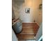 Practical utility room with water heater, wiring, and storage shelving for convenient organization at 413 Summit Ridge Pl # 115, Longwood, FL 32779
