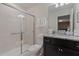 Bathroom featuring single sink vanity with granite countertop and glass-enclosed shower at 4321 Lana Avenue, Davenport, FL 33897