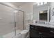 Bathroom featuring single sink vanity with granite countertop and glass-enclosed shower at 4321 Lana Avenue, Davenport, FL 33897