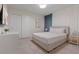 Bright bedroom featuring neutral walls, white trim, and a comfortable queen-size bed at 4321 Lana Avenue, Davenport, FL 33897