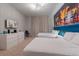 Bedroom featuring modern decor, a large mural, and stylish furnishings at 4321 Lana Avenue, Davenport, FL 33897