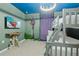 Whimsical bedroom with a bunk bed, fun decor, and a tower mural at 4321 Lana Avenue, Davenport, FL 33897