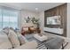 Comfortable living room with modern furnishings, accent wall and large windows providing plenty of natural light at 4321 Lana Avenue, Davenport, FL 33897