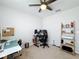 Bedroom featuring functional desk, a ceiling fan, and storage shelving for an organized room at 460 Lily Ln, Davenport, FL 33837