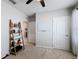 Bedroom with storage shelving, an open doorway, and a clean, organized layout at 460 Lily Ln, Davenport, FL 33837