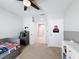 Bedroom view showcases a neutral color scheme and two entry doorways, one leading to another room at 460 Lily Ln, Davenport, FL 33837