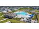 Aerial view of a community pool with lounge chairs and umbrellas at 460 Lily Ln, Davenport, FL 33837