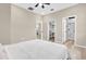 Spacious bedroom showcasing neutral tones and open access to a walk-in closet and modern bathroom at 4955 Castle E St, Kissimmee, FL 34758