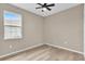 Cozy bedroom with a window view and ceiling fan at 4955 Castle E St, Kissimmee, FL 34758