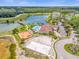 An aerial view of the community amenities including a pool, lake, and playground at 4955 Castle E St, Kissimmee, FL 34758