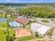 An aerial view highlighting community amenities including a pool, playground, and volleyball court at 4955 Castle E St, Kissimmee, FL 34758