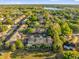 Aerial view of a community of townhomes with lush trees and landscaping at 5020 Ashford Falls Ln, Oviedo, FL 32765