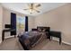 Neutral bedroom with a ceiling fan, carpet and a bed with a galaxy-themed comforter at 5020 Ashford Falls Ln, Oviedo, FL 32765