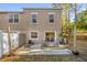 Back exterior view with patio, patio furniture and string lights at 5020 Ashford Falls Ln, Oviedo, FL 32765