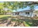 View of the backyard and screened in patio at 5210 Grandview Dr, Orlando, FL 32808