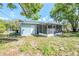 View of the backyard and screened in patio at 5210 Grandview Dr, Orlando, FL 32808