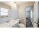 A full bathroom featuring a modern vanity, toilet, mirror, and neutral color palette at 5210 Grandview Dr, Orlando, FL 32808