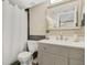 Well-lit bathroom with modern vanity, mirror, shower, and neutral color scheme at 530 E Central Blvd # 501, Orlando, FL 32801