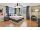 Inviting bedroom with natural light, laminate floors, and stylish furnishings at 530 E Central Blvd # 501, Orlando, FL 32801