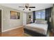 Comfortable bedroom featuring a large window, plush bedding, and modern decor at 530 E Central Blvd # 501, Orlando, FL 32801