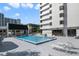 Condo community's outdoor pool area for residents, complemented by lounge chairs for relaxation at 530 E Central Blvd # 501, Orlando, FL 32801