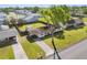 An aerial view of the house, highlighting the expansive yard and mature trees at 536 Ellerbe Way, Lakeland, FL 33801