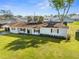 An elevated angle of the home displays a well-manicured lawn and newer roof at 536 Ellerbe Way, Lakeland, FL 33801