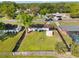 Aerial view of the fenced backyard showcasing the playset and storage shed at 536 Ellerbe Way, Lakeland, FL 33801