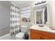 Cozy bathroom featuring a shower/tub combination, toilet and vanity at 536 Ellerbe Way, Lakeland, FL 33801