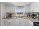 Kitchen features granite countertops and stainless steel sink under a window at 536 Ellerbe Way, Lakeland, FL 33801