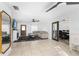 Bright living room with tile flooring, a fireplace, and access to the dining area at 536 Ellerbe Way, Lakeland, FL 33801