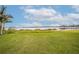 Lush backyard featuring a serene lake and private boat docks, perfect for waterfront living at 5790 Crystal Beach Rd, Winter Haven, FL 33880