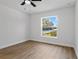 Bedroom with a well-lit window showing the neighborhood street view at 5790 Crystal Beach Rd, Winter Haven, FL 33880