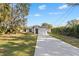 Attractive single-story home featuring a long driveway and manicured front lawn at 5790 Crystal Beach Rd, Winter Haven, FL 33880