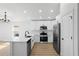 Modern, well-lit kitchen featuring stainless steel appliances, white cabinets, and an island at 5790 Crystal Beach Rd, Winter Haven, FL 33880