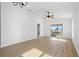 Spacious living room featuring wood-look floors and sliding glass doors to the outside at 5790 Crystal Beach Rd, Winter Haven, FL 33880