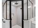 Close up of a modern shower stall with gray vertical tile, a glass enclosure, and sleek, black fixtures at 5790 Crystal Beach Rd, Winter Haven, FL 33880